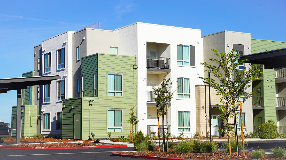Modern apartment building with green accents