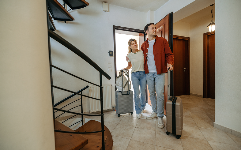 Man and woman arriving with luggage
